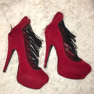 Red heals with black staps